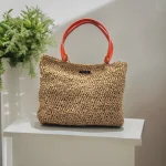 Celia II Sac cabas crocheté en raphia marron café r avec anses en cuir orange à pressions