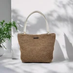 Celia II Sac cabas crocheté en ficelle de jute beige avec anses en cuir blanches à pressions couleur bronze