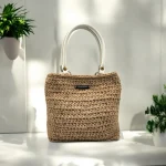 Pia Sac cabas crocheté en ficelle de jute beige avec anses en cuir blanches à pressions couleur bronze